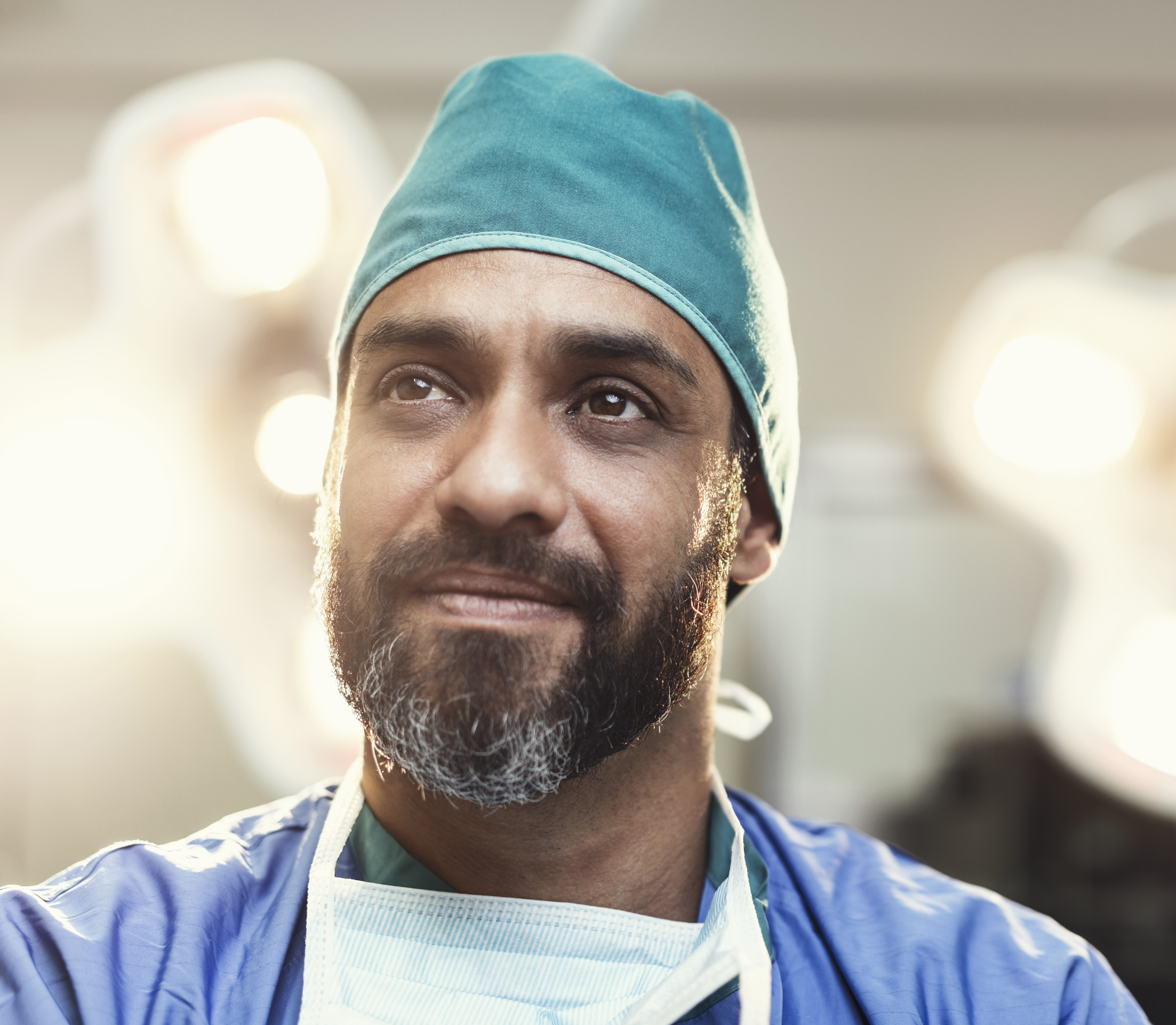 Bearded male surgeon working in operating room